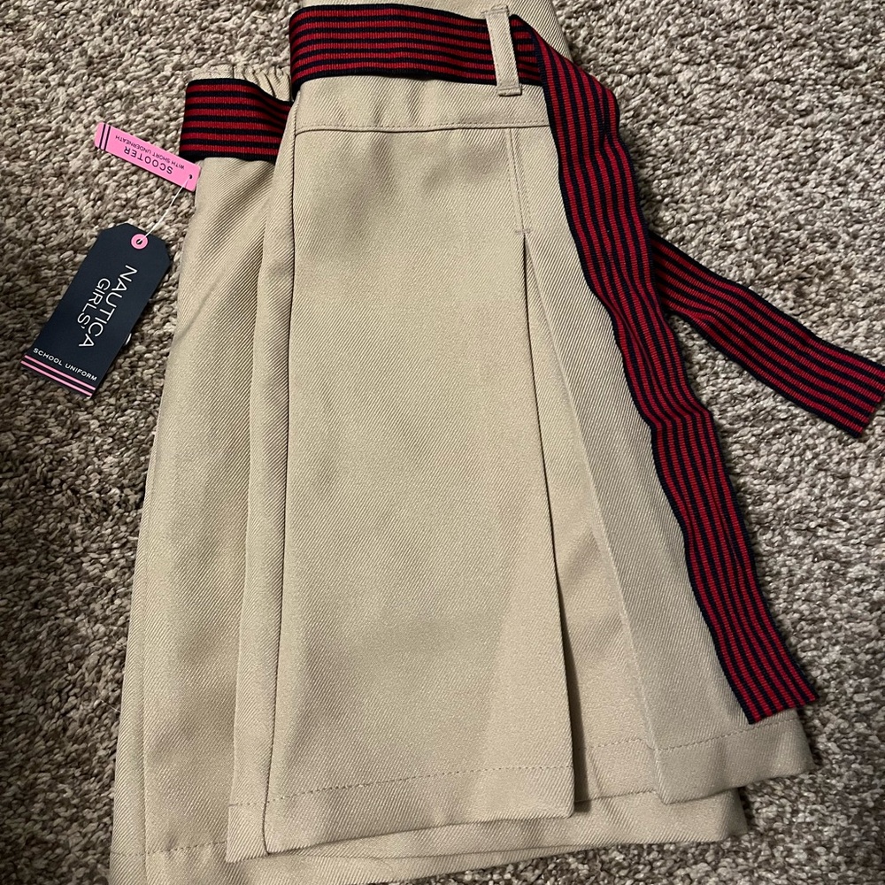 Beige Skirt with Red and Black Striped Belt